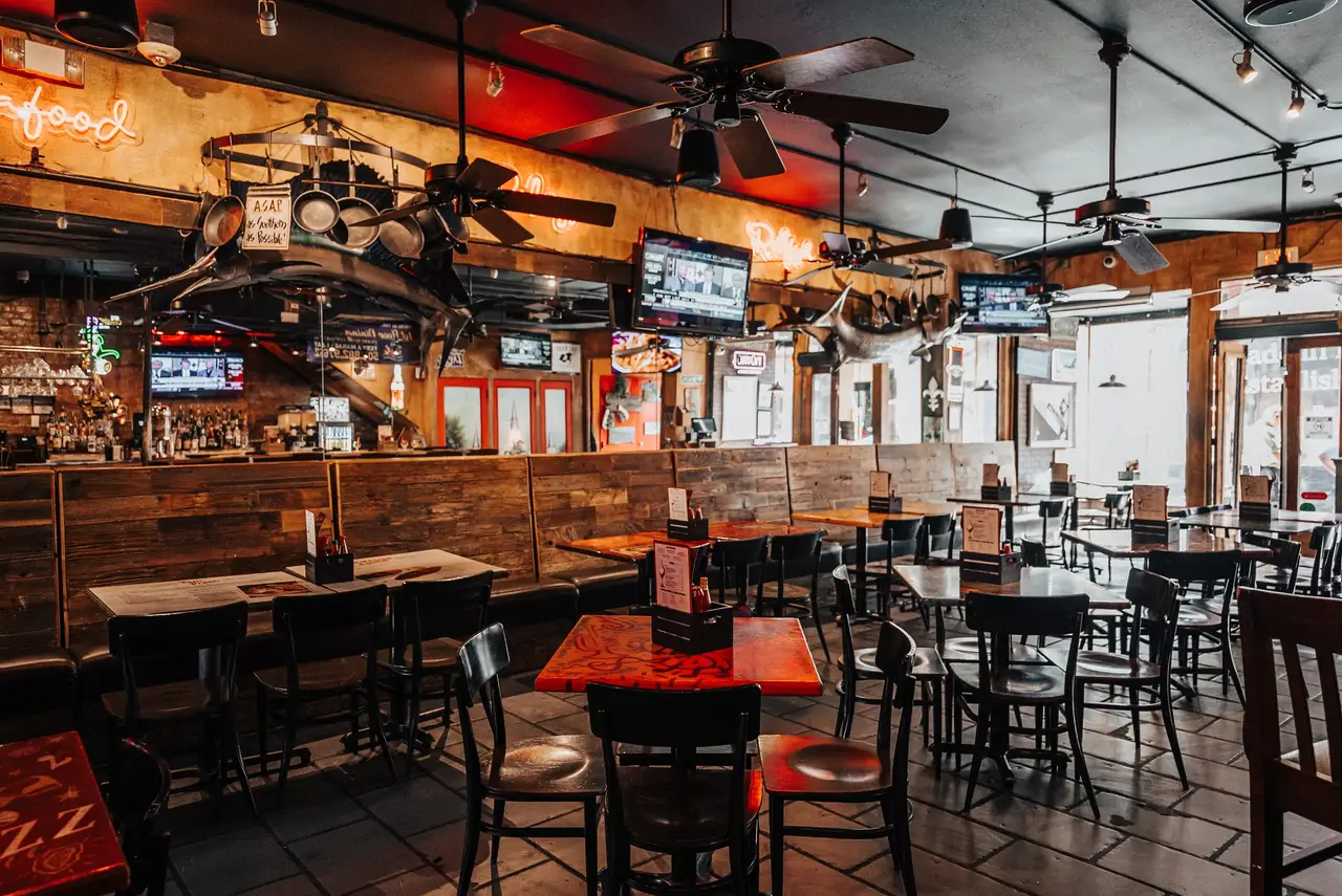 Wood-paneled dining area beside the main bar